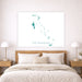 Map of The Bahamas on a wall above a bed in a bedroom.