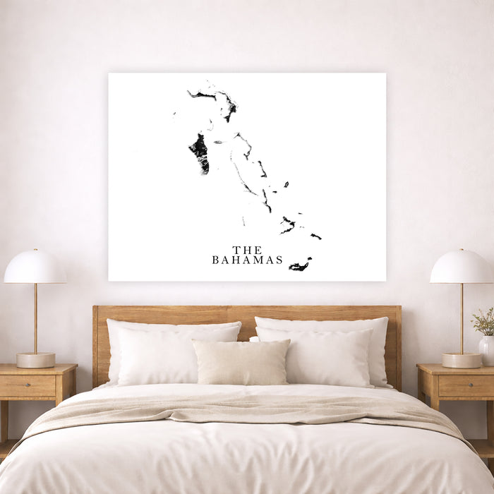 Map of The Bahamas on a wall above a bed in a bedroom setting