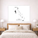 Map of The Bahamas on a wall above a bed in a bedroom setting