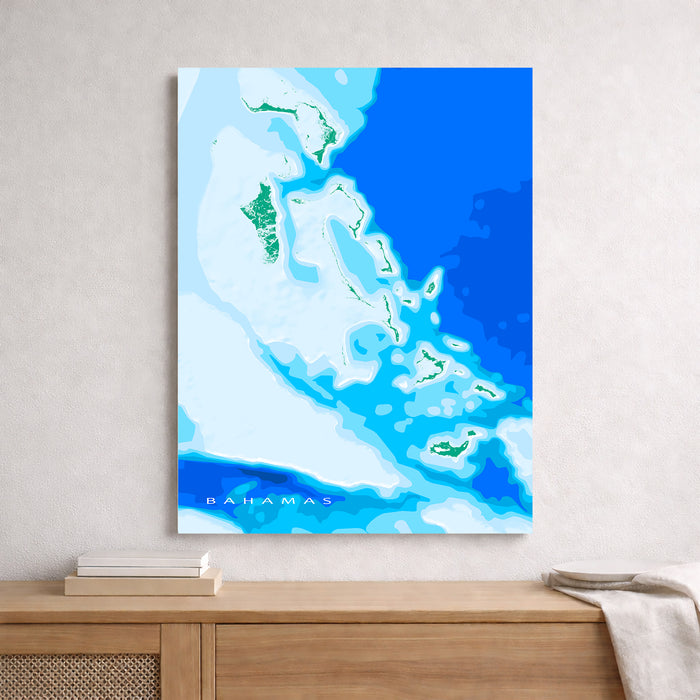 Map of the Bahamas on a blue background, framed and leaning against a wall.