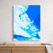 Map of the Bahamas on a blue background, framed and leaning against a wall.