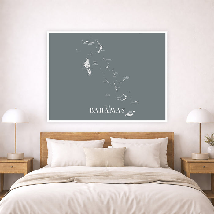 Framed map of The Bahamas above a bed in a bedroom setting