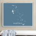 Framed map of The Bahamas on a blue background, hanging on a beige wall above a white surface.