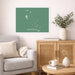 Living room with a map of The Bahamas on the wall, a gray sofa, wooden cabinet, and decorative items.