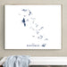 Framed map of The Bahamas on a wall above a white bench.