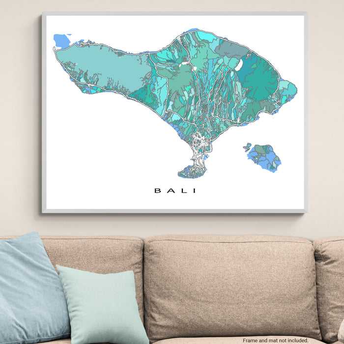 Framed map of Bali on a wall above a sofa