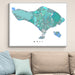Framed map of Bali on a wall above a sofa