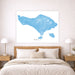 Map of Bali on a wall above a bed in a bedroom setting