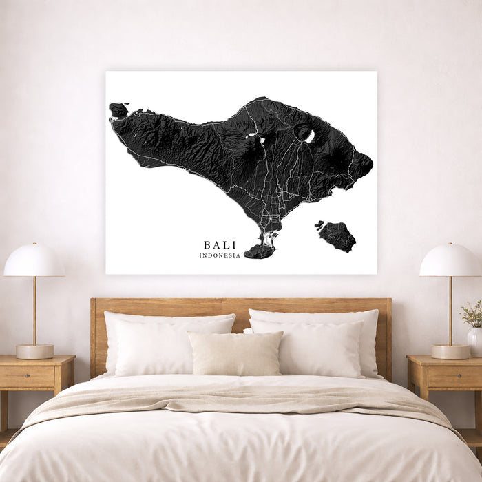Map of Bali on a wall above a bed in a bedroom