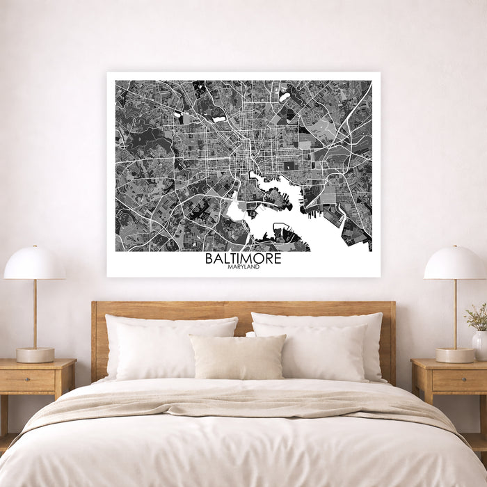 Framed map of Baltimore above a bed in a bedroom setting