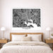 Framed map of Baltimore above a bed in a bedroom setting
