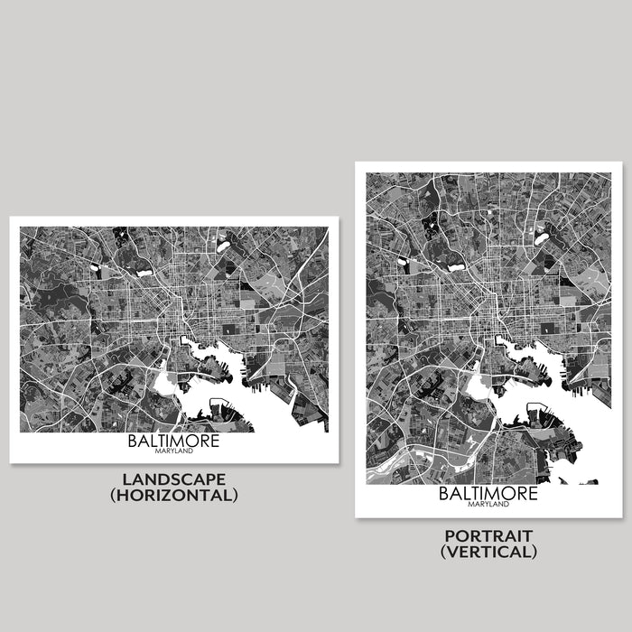 Two map prints of Baltimore, one landscape and one portrait, on a gray background.