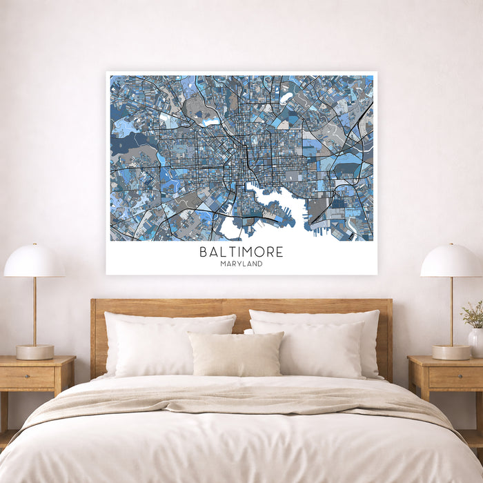 Framed map of Baltimore on a wall above a bed with wooden headboard and nightstands.
