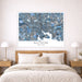 Framed map of Baltimore on a wall above a bed with wooden headboard and nightstands.
