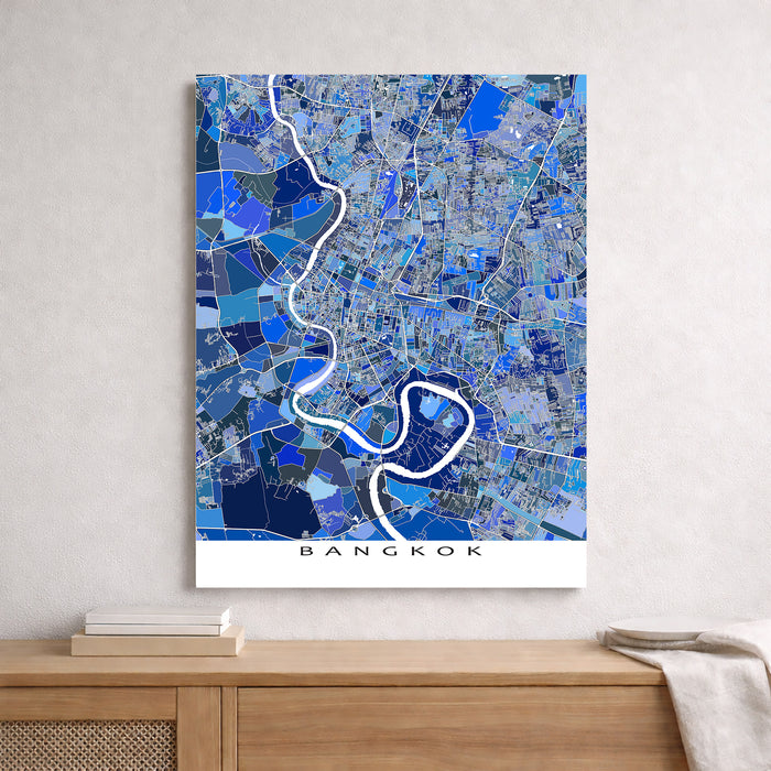 Map of Bangkok on a wall above a wooden surface