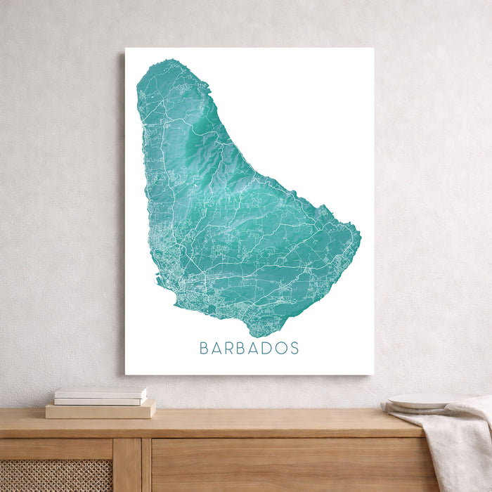 Map of Barbados on a white wall above a wooden surface