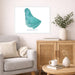 Living room with a map of Barbados on the wall, a couch, and a wooden cabinet.