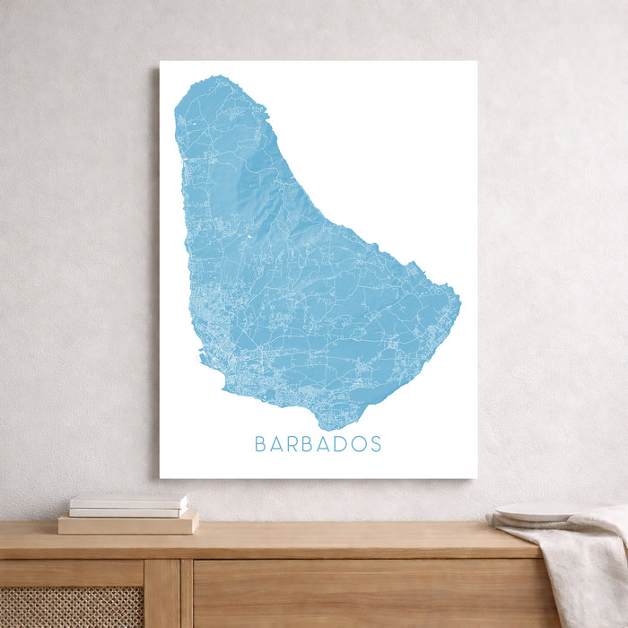 Map of Barbados on a white background above a wooden surface