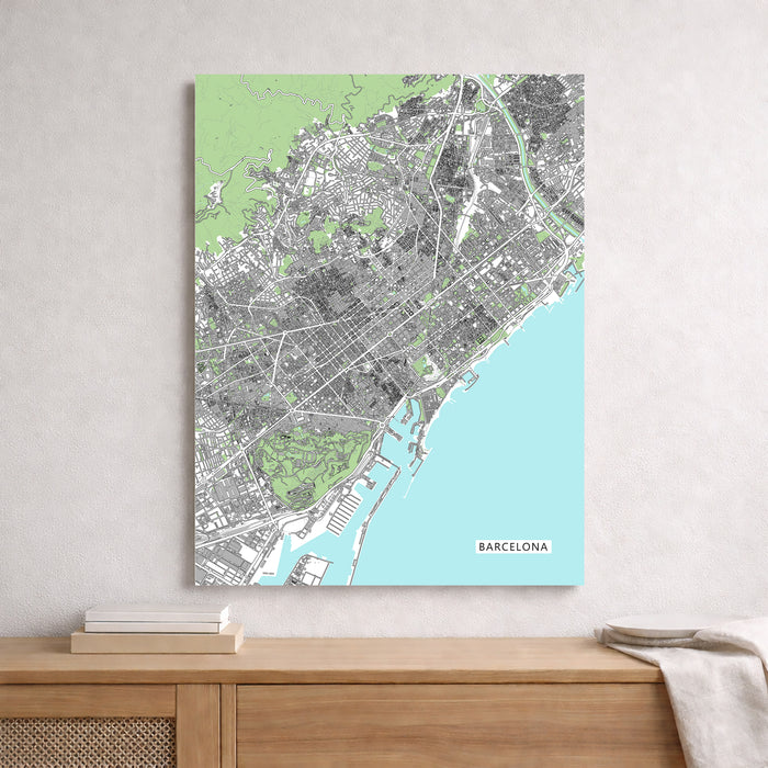 City map of Barcelona on a wall above a wooden surface