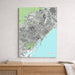 City map of Barcelona on a wall above a wooden surface