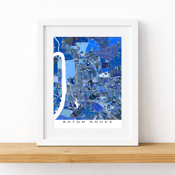 Framed map of Baton Rouge on a white surface with a wooden ledge.