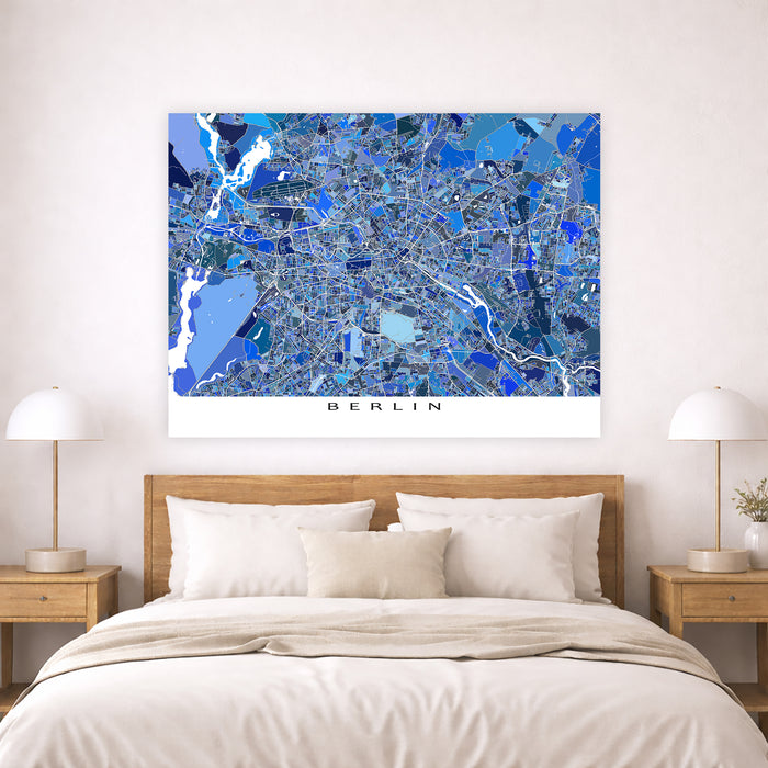 Map of Berlin on a wall above a bed in a bedroom setting