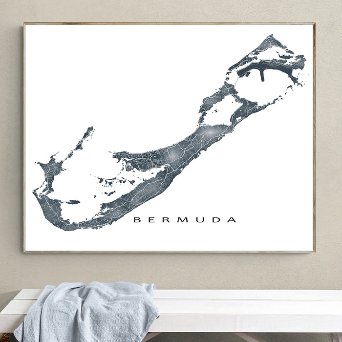 Framed map of Bermuda on a wall above a bench.