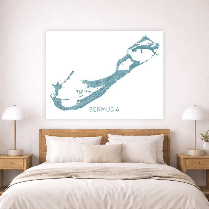 Map of Bermuda on a wall above a bed in a bedroom setting