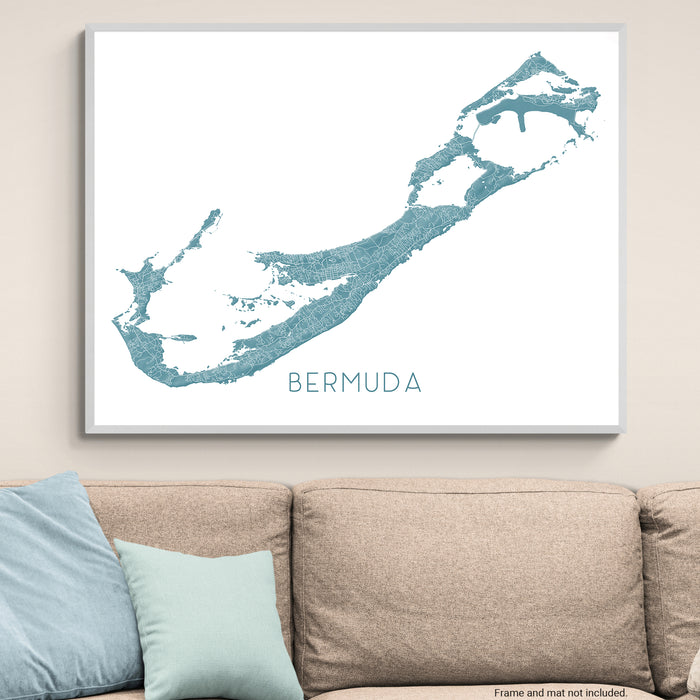 Map of Bermuda framed on a wall above a sofa