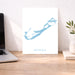 Map of Bermuda on a white background next to a laptop on a wooden desk.