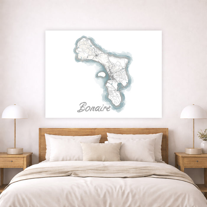 Map of Bonaire on a wall above a bed in a bedroom setting