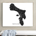 Framed map of Bonaire on a wall above a white surface.
