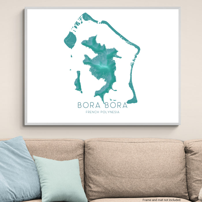 Framed map of Bora Bora on a wall above a beige sofa with light blue pillows.