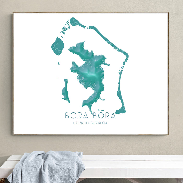 Framed map of Bora Bora on a wall above a bench.