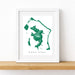 Framed map of Bora Bora with a white border on a wooden surface.