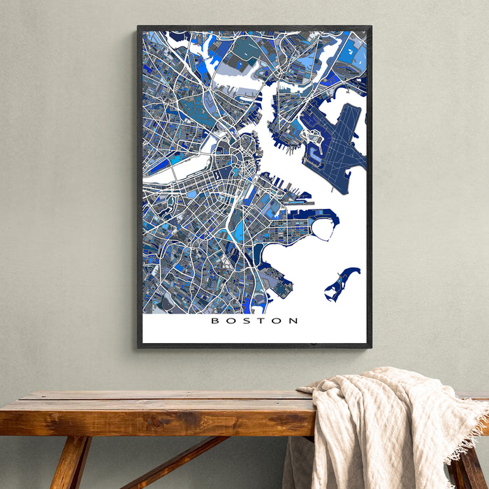 Framed map of Boston on a wall above a wooden bench.