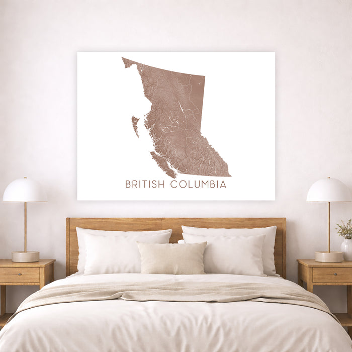 Map of British Columbia on a wall above a bed in a bedroom setting