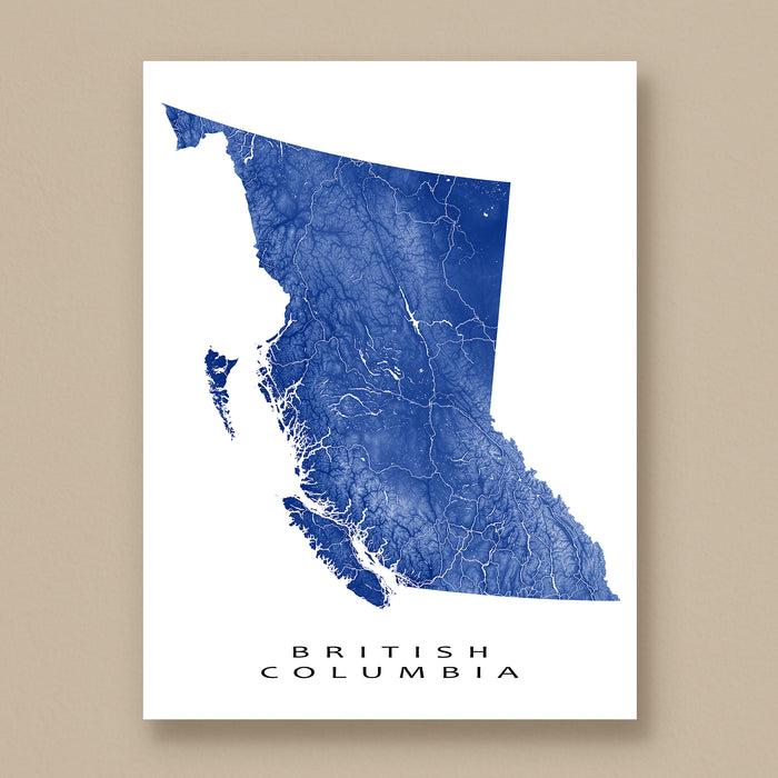 Map of British Columbia in blue on a white background, displayed on a beige wall.