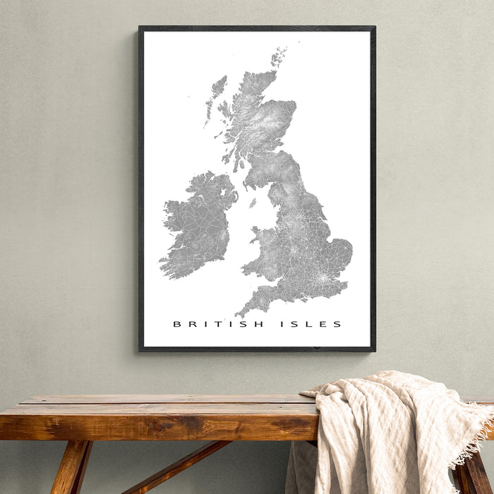 Framed map of the British Isles on a wall above a wooden bench.