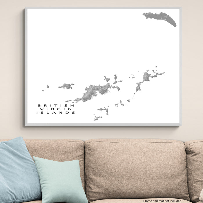 Framed map of the British Virgin Islands on a wall above a sofa.