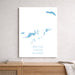 Map of British Virgin Islands on a white wall above a wooden shelf.