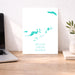 Map of British Virgin Islands on a white background, displayed on a wooden desk with a laptop and plant.