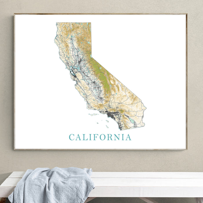 Framed map of California on a wall above a bench with a towel.