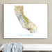 Framed map of California on a wall above a bench with a towel.