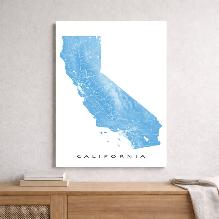 Map of California on a white background above a wooden surface