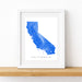 Framed map of California with a blue outline on a white background