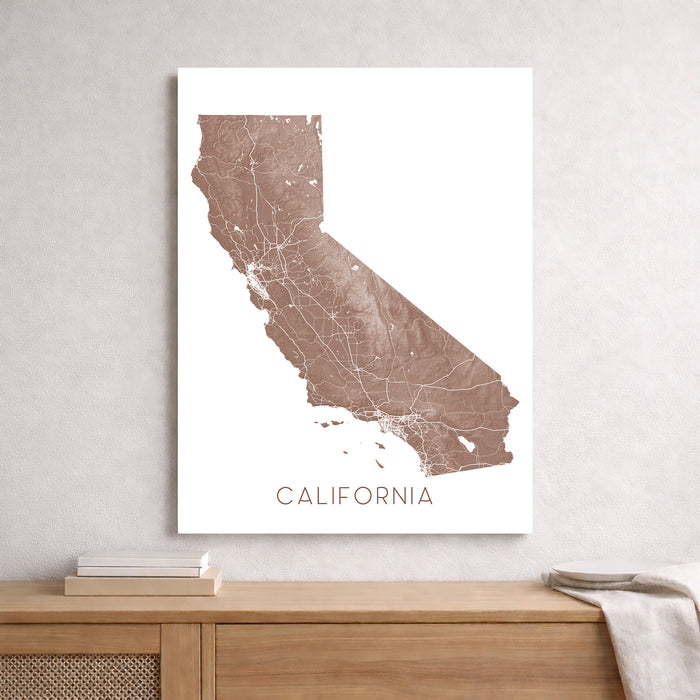 Map of California on a white background above a wooden surface.