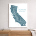 A vertical white wall art print featuring a blue-gray topographic map of California with the text 'CALIFORNIA' and 'HOME SWEET HOME SAN FRANCISCO,' displayed above a wooden console table against a light gray wall.