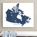 Framed map of Canada on a wall above a white surface.