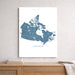 Map of Canada on a white background, displayed on a wall above a wooden shelf.
